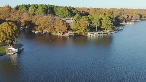 aerial view of lake shore houses with fall colors