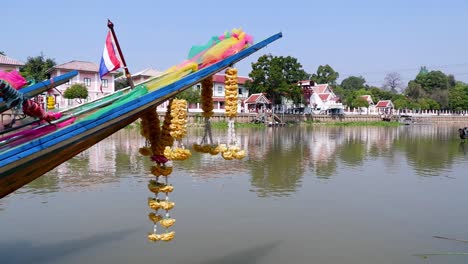 decorated boat on calm river in ayutthaya