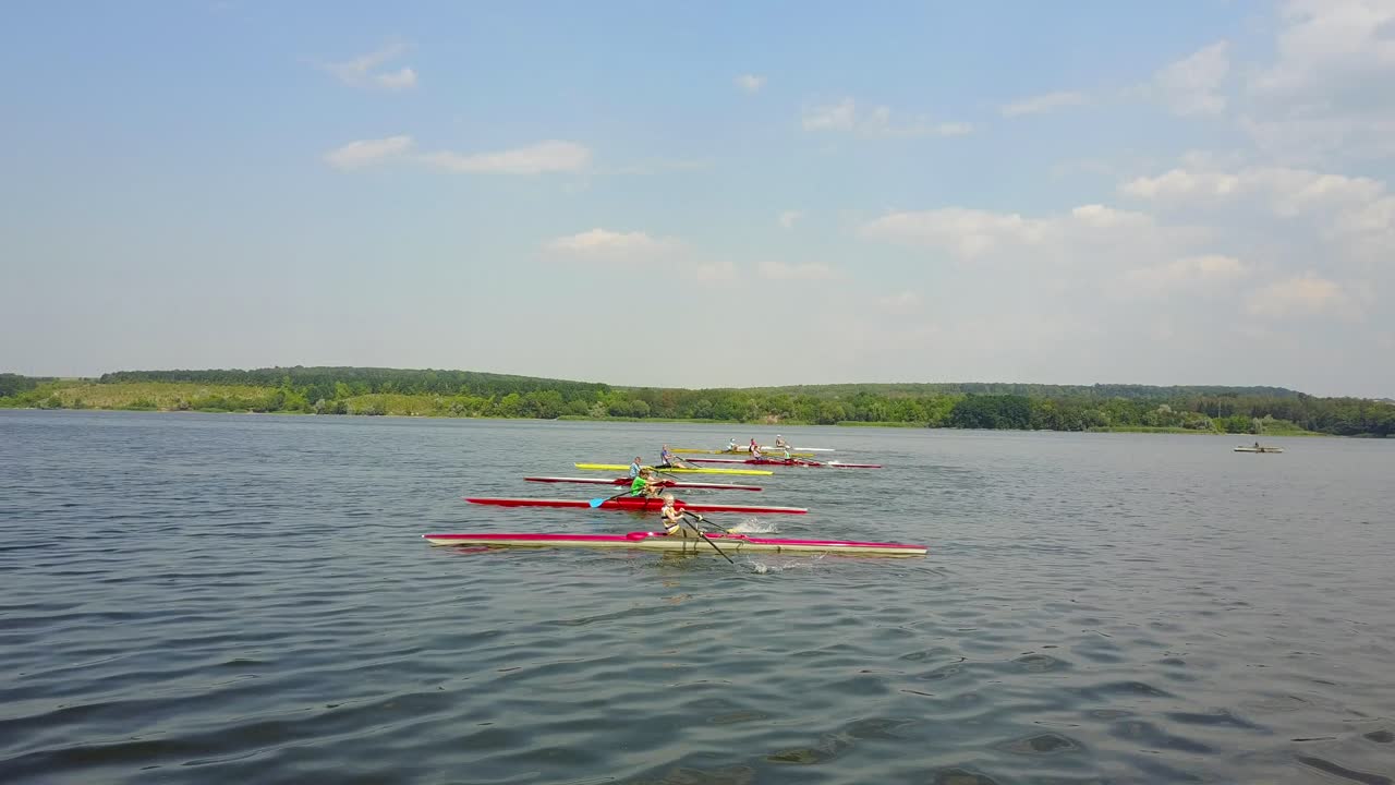 Athletes Training On Kayaks. Group of young athletes training for whitewater rafting