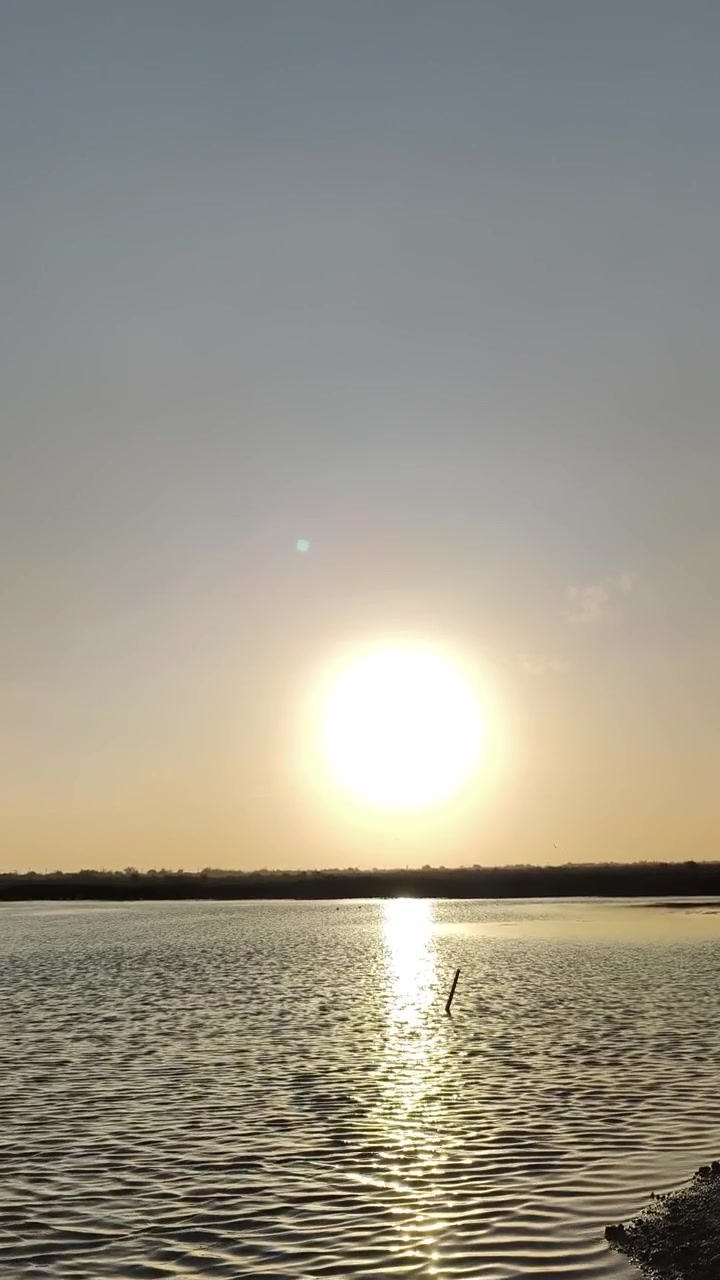 Golden Sunset Over Calm Lake Water