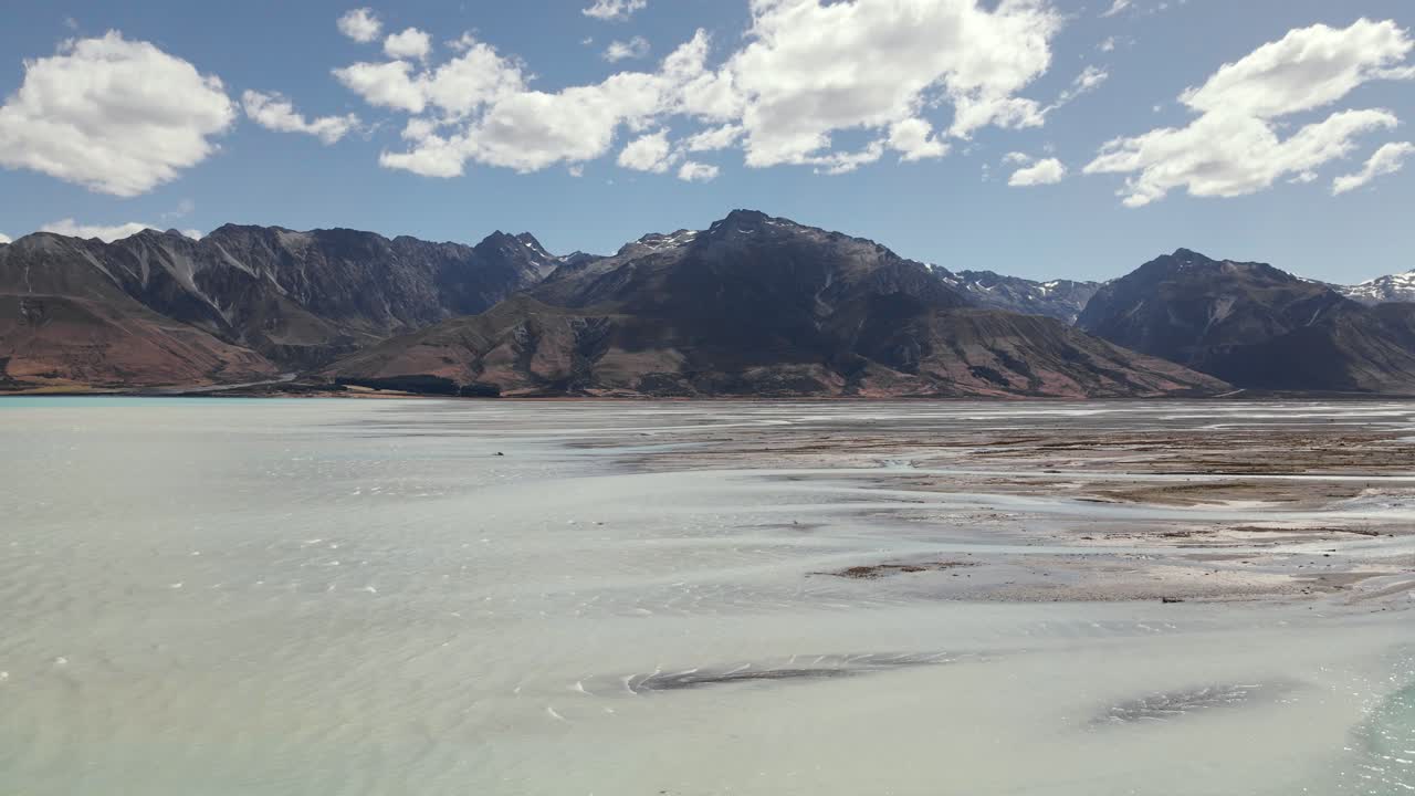 Scenic aerial over river delta floodplain where Tasman river meets Lake Pukaki
