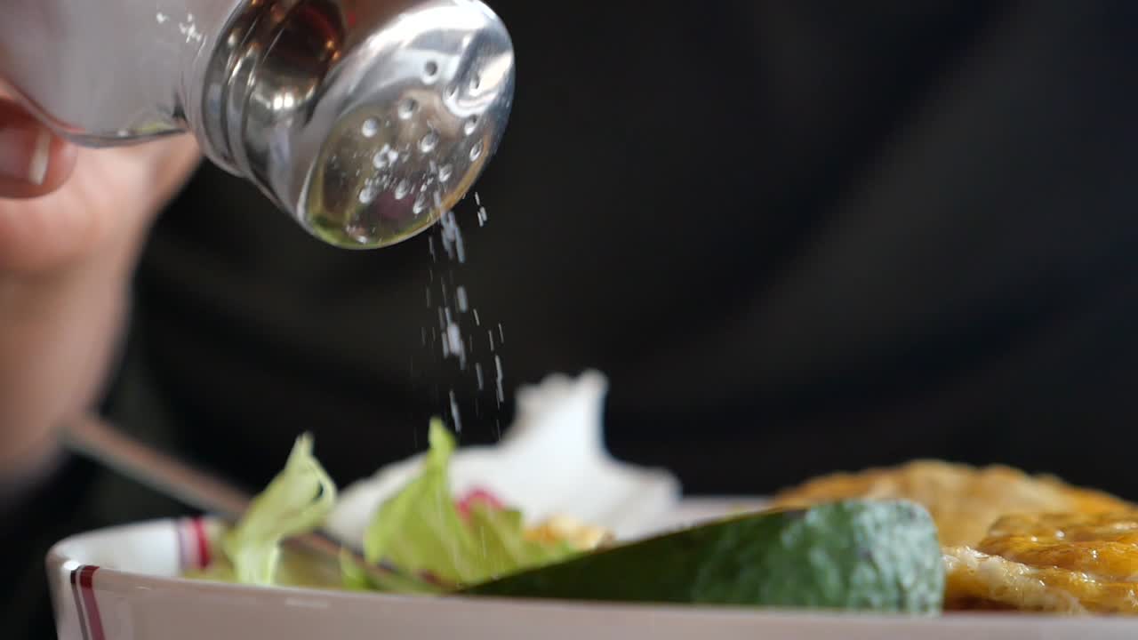 Adding salt to a meal