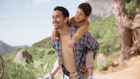 Piggyback,-kid-or-father-hiking-in-nature