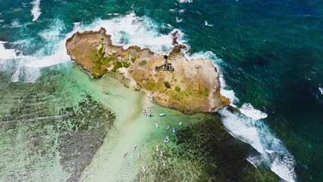 Aerial-drone-view-of-a-lighthouse-on-Ile-aux-Fouquets,-Ile-au-Phare,-Bois-des-Amourettes,-Mauritius