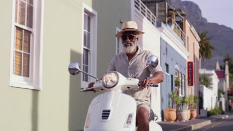 man riding scooter in the city