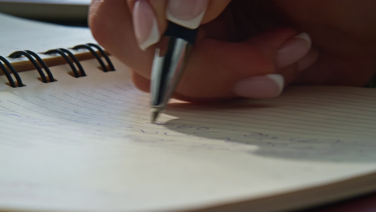 Woman hands writing notebook holding ballpen closeup. Businesswoman making notes