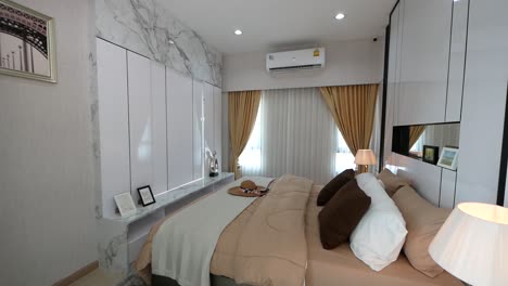 modern and luxury master bedroom with marble tiles wall decoration