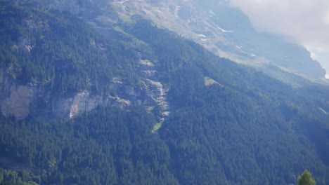 Grindelwald,-village,-Switzerland,-mountains,-alps,-clouds,-forests,-glacier