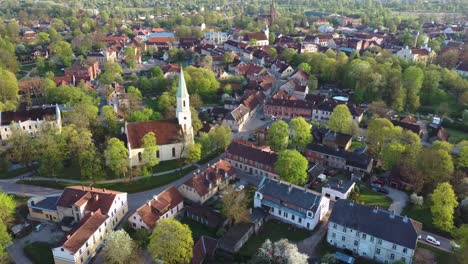 aerial view of kuldiga old town with red roof tiles and evangelical lutheran church of saint catherine in kuldiga, latvia