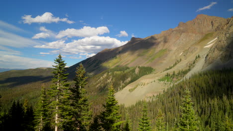 Cinematic-aerial-Ridgway-Silverton-Telluride-14er-Mount-Sniffels-Wilderness-Blue-Lakes-trailhead-late-afternoon-bluebird-day-light-clouds-stunning-Colorado-Rocky-Mountain-landscape-breeze-slow-left