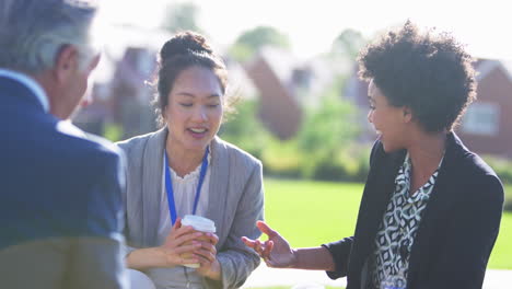 Multi-Cultural-Business-Team-Sitting-Outside-Office-For-Coffee-Break-Have-Informal-Meeting