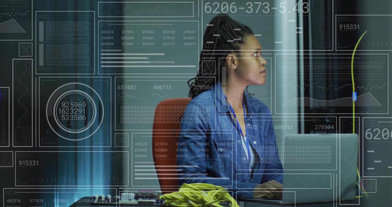 Female IT Specialist Working on Laptop in Server Room