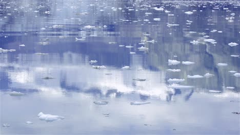 reflection of mountains in the water while entering johns hopkins inlet in glacier bay national park alaska