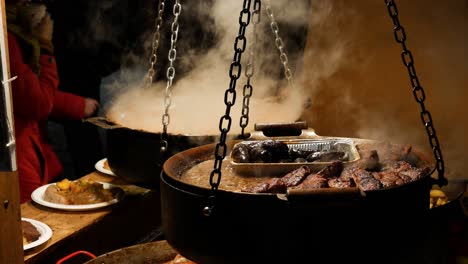 Cooking-street-food-in-Tallinn's-Christmas-Market,-Estonia