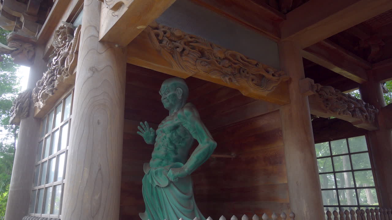 This is a guardian who is usually at the entrances of Buddhist temples in Japan, his name is Kongorikishi. They are very old carved wooden sculptures.