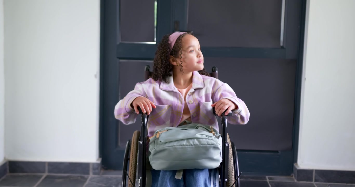African American girl grabbing rims, moving wheelchair on hall to reach door with headband and bag