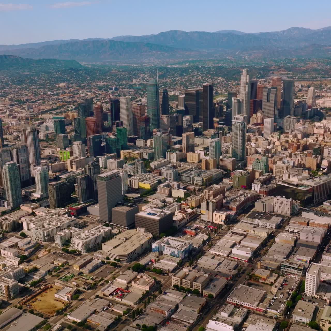 Los Angeles financial centre with beautiful skyscrapers. Scenic view of great city in California at the backdrop of hills
