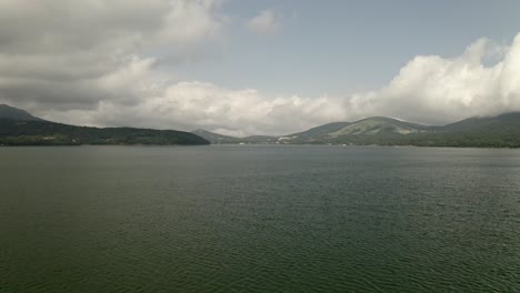 Drone-Aerial-over-Lake-Yamanaka-and-Mount-Fuji,-Japan,-Asia