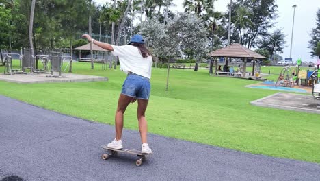 woman skateboarding in a park