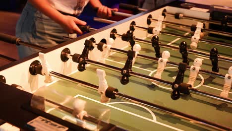 players engaged in a lively foosball match