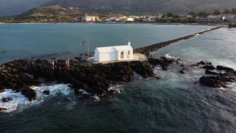 georgiopoli town and beautiful white chapel, aerial orbit view