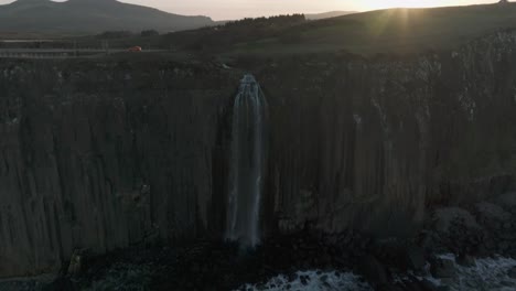 fast closing shot of the mealt falls at sunset on the isle of skye