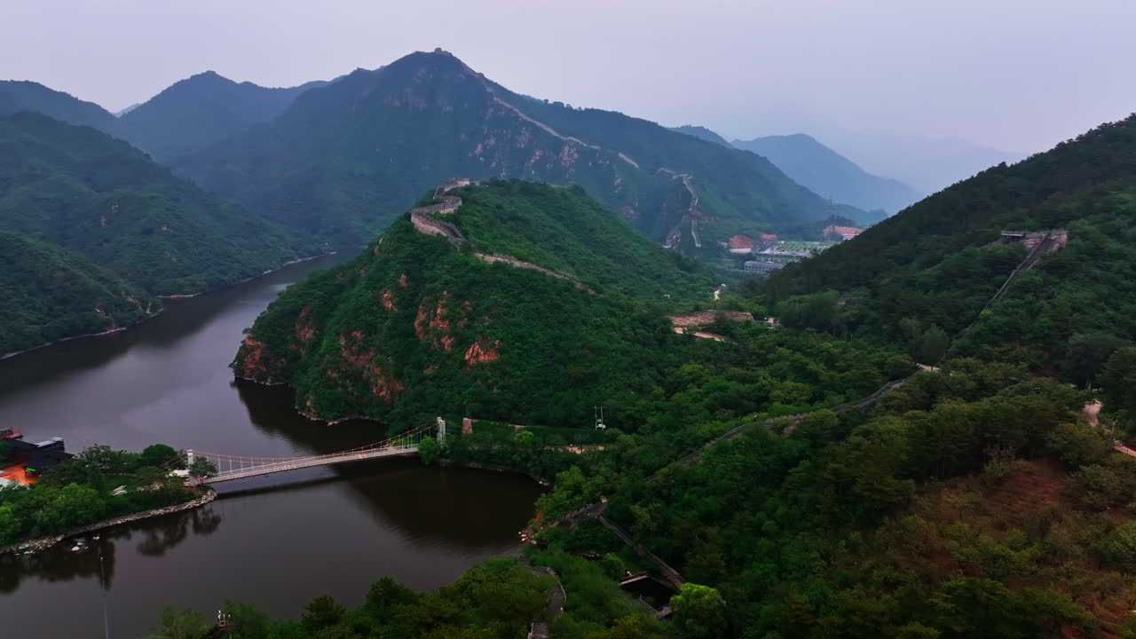 Aerial view over the Huanghuacheng Great Wall area, gloomy, summer day in China