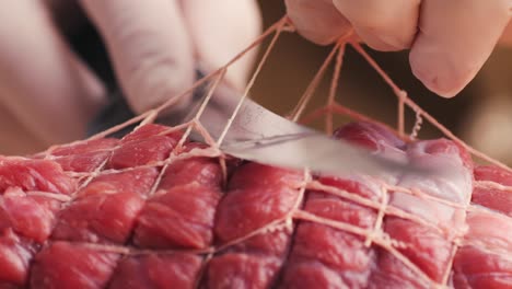 preparing a tied roast
