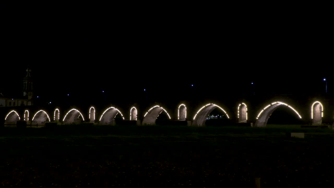 Night view of the beautifully illuminated Roman bridge of Ponte de Lima.