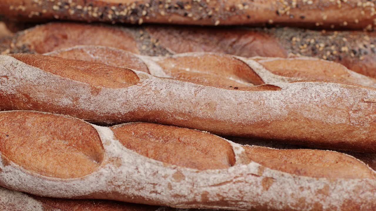 Fresh Artezan bread close-up. Artisan bread is making by skill bakers using natural and high-quality ingredients. Food with health and flavour benefits. Bakery shop and market