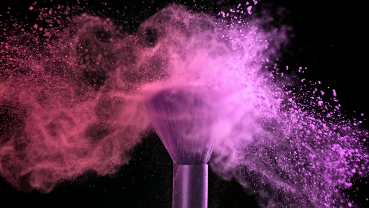 Slow Motion of Pink and Purple Powder Exploding from Makeup Brush