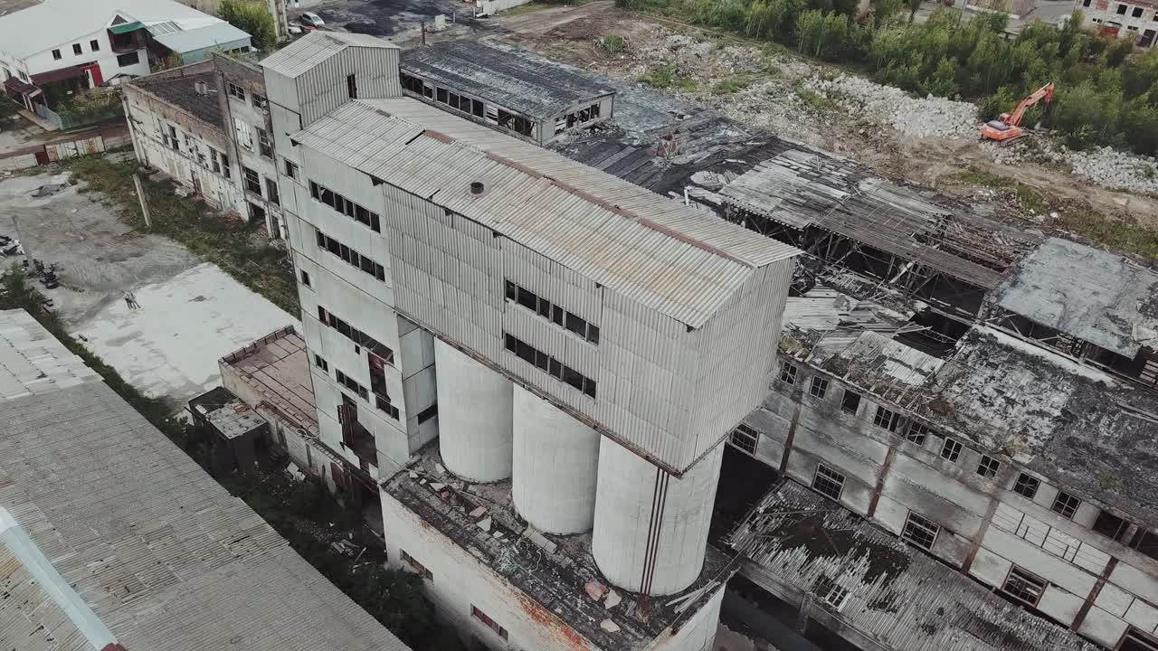 Abandoned industrial building. Ruins of an old factory. Aerial view