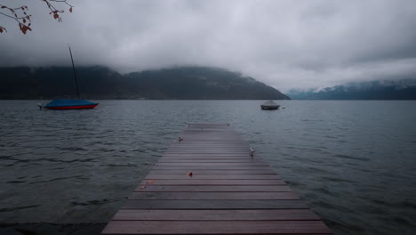 lake thun, spiez, switzerland - dock on a cloudy day