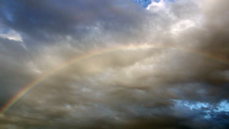 rainbow through clouds