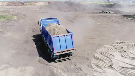 dump truck carrying materials at construction site