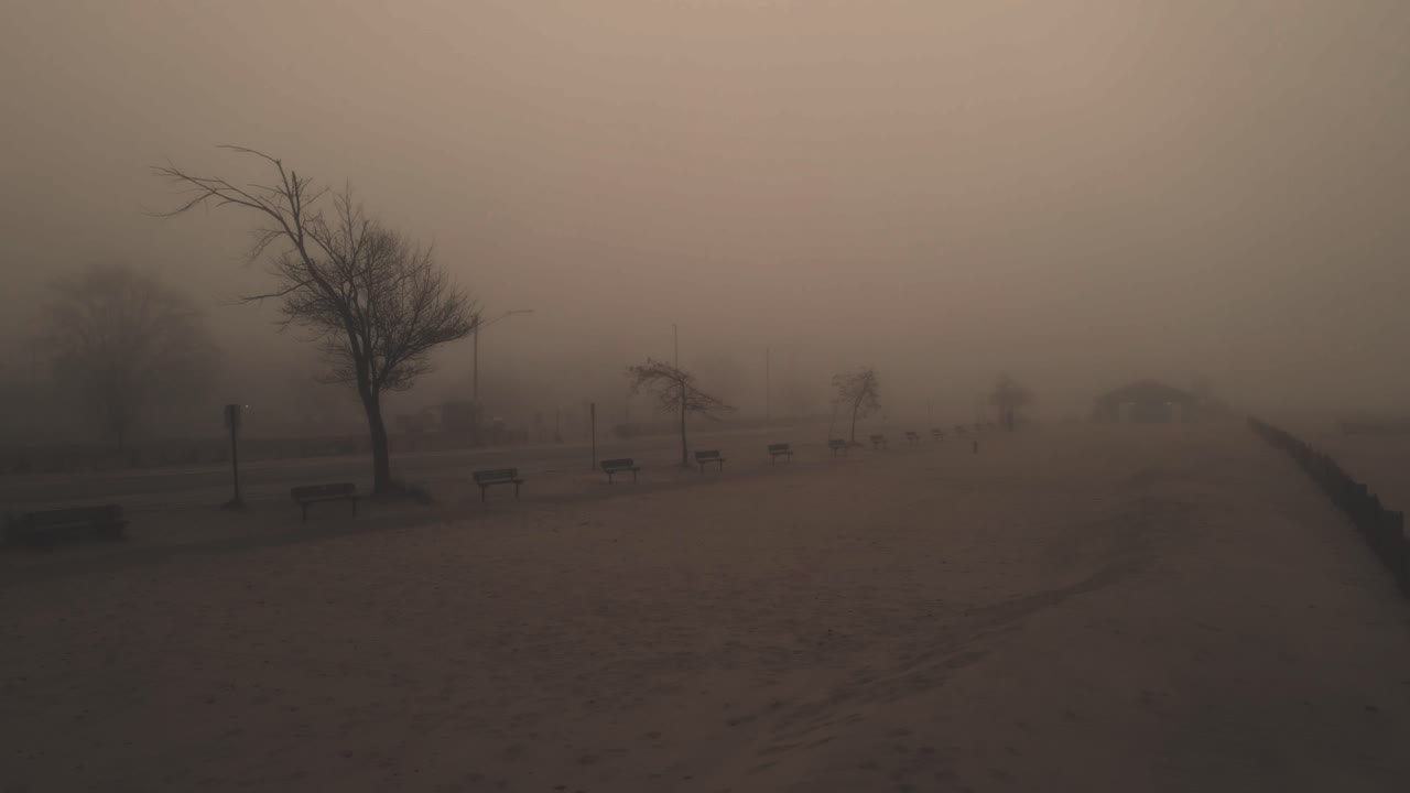 Reverse motion, pulling away from a creepy mist covered beach
