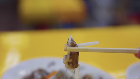 san-nakji, korean long arm octopus searched live, wriggling on chopsticks