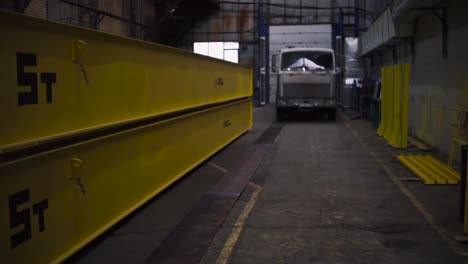 yellow crane beams in an industrial warehouse