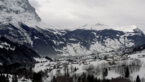 Drone-Aerial-view-of-the-snowy-Grindelwald-and-the-Eiger-in-the-beautiful-swiss-mountain-landscape