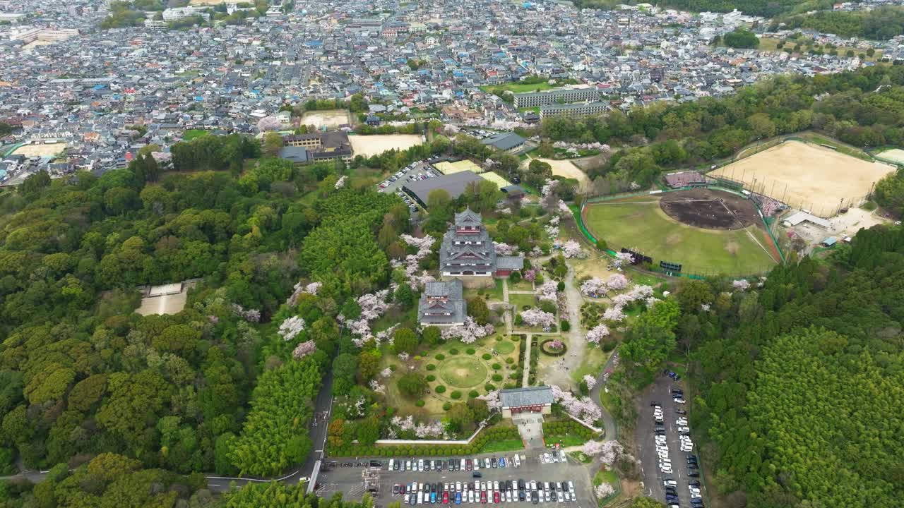 Fushimi Castle view in Kyoto Japan, traditional Architecture, Drone Aerial rises above Japanese old Capital town