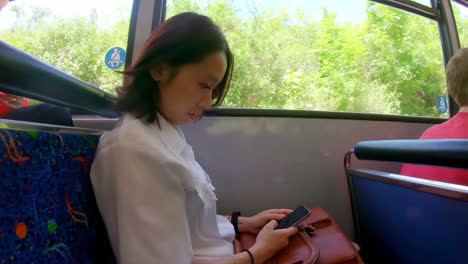 Woman-checking-time-while-using-mobile-phone-4k