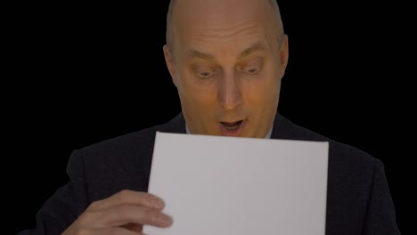 adult caucasian man in classical formal suit open gift box. man looking into gift box and looking to camera, speaking. close up head shot. alpha channel chroma key transparent background. front view.