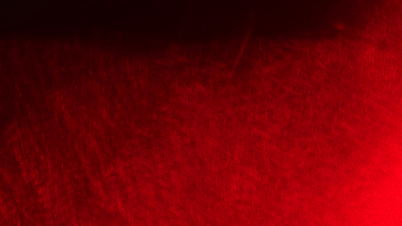 Sfondi video astratti rosso scuro con texture a grana di polvere