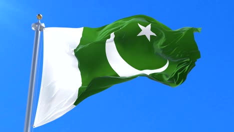bandera de pakistán ondeando en el viento con el cielo azul en lento, bucle