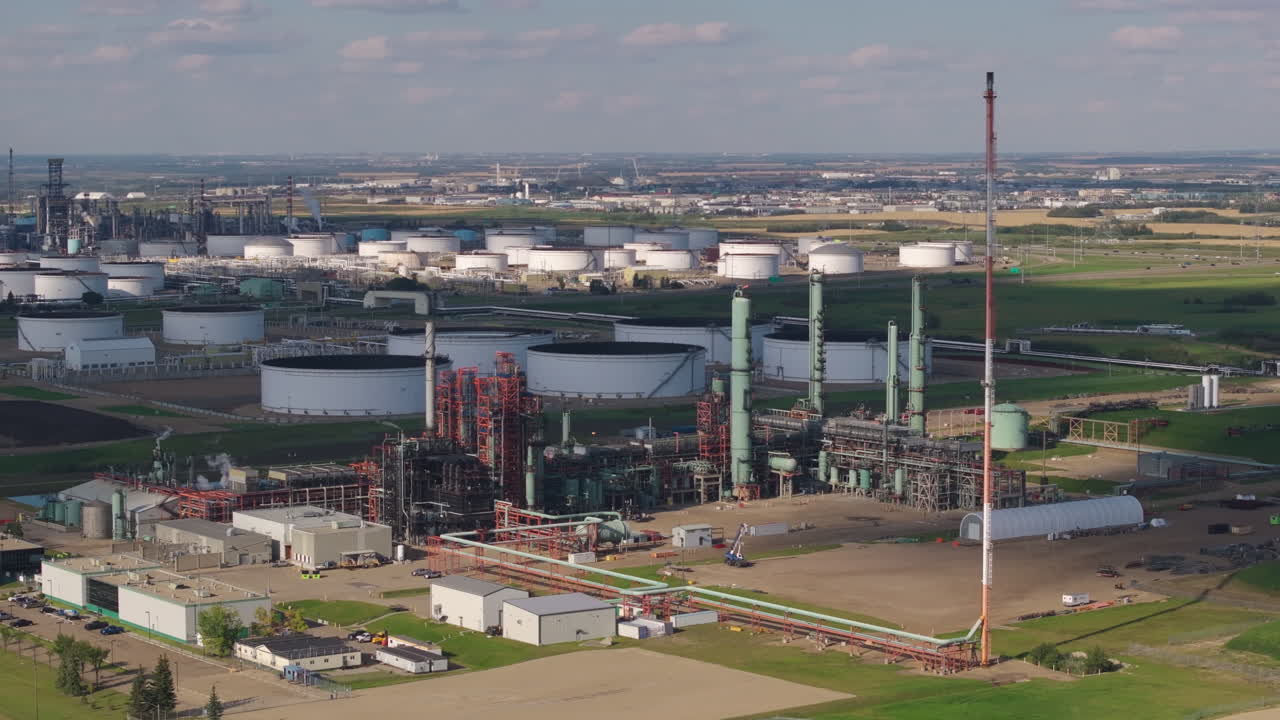 Aerial view of large oil refinery on a sunny day, vast industrial scene