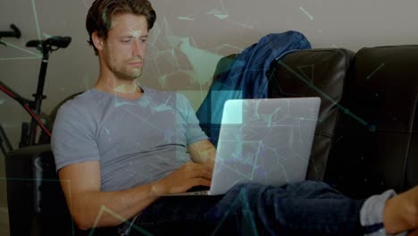 animation of squares and connected dots forming geometric shape, caucasian man using laptop