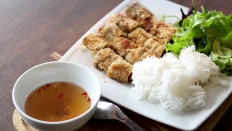 traditional vietnamese dish with noodles and greens