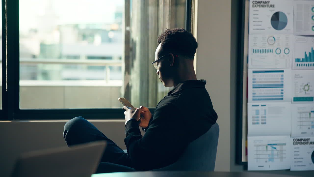 Man in Office Looking at Financial Data