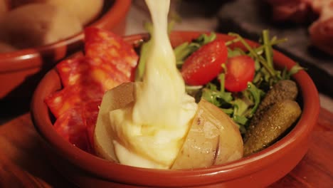 italian or spanish restaurant with traditional tapas food, spanish cuisine, delicious tapas and cheese plate, bruschetta with cheese, olives dry tomatoes and tasty sandwich bar appetizer, buffet