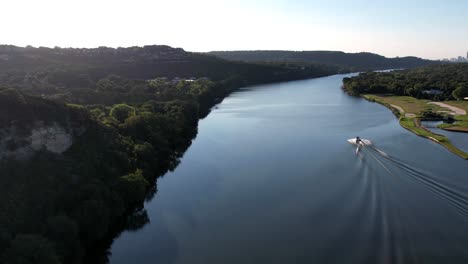 Small-boat-is-cruising-on-Colorado-River-in-Austin